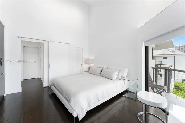 a bedroom with a bed and a table in it