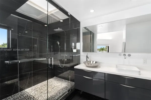 a bathroom with a double vanity sink and mirror