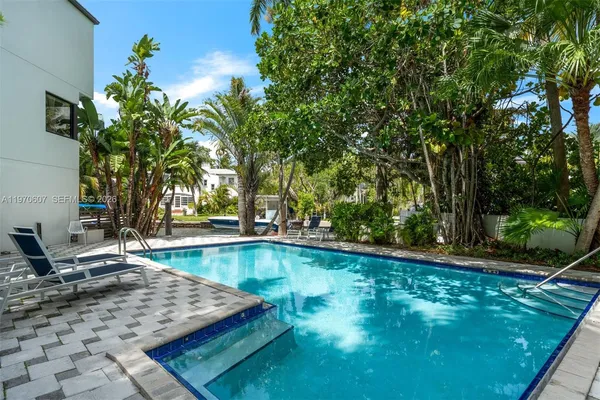 a view of a swimming pool with a patio