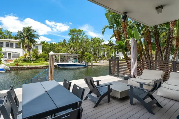 a view of a lake with furniture