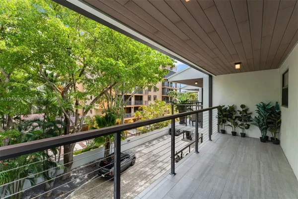 a view of balcony with furniture