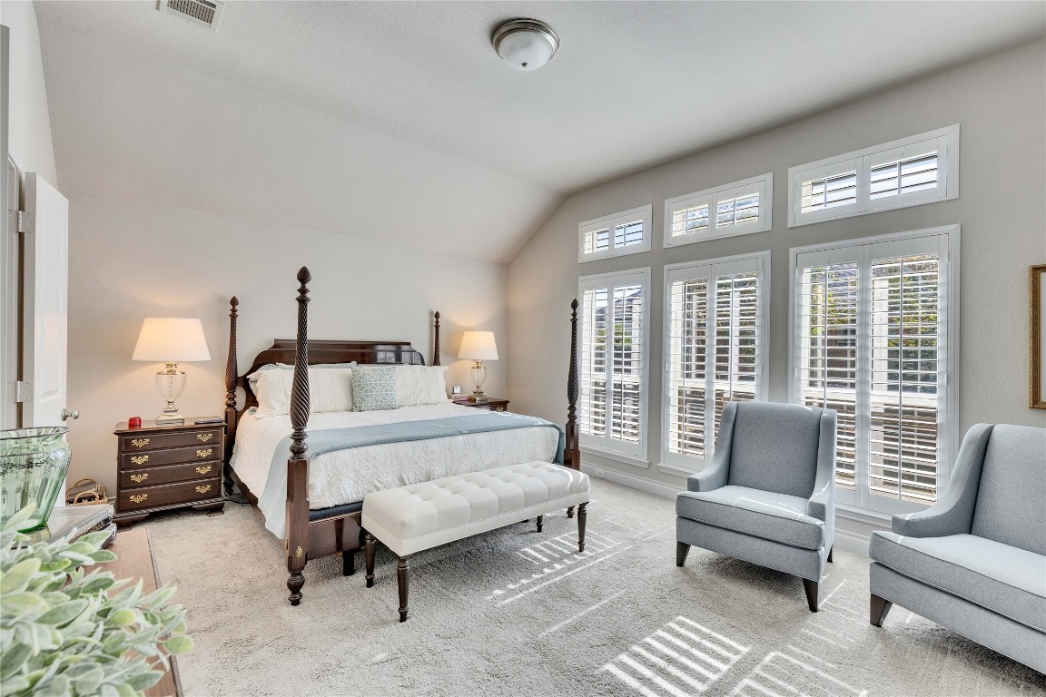4229 Mercer Road Georgetown, TX 78628 - Photo 14 of 38 Carpeted bedroom with lofted ceiling and visible vents
