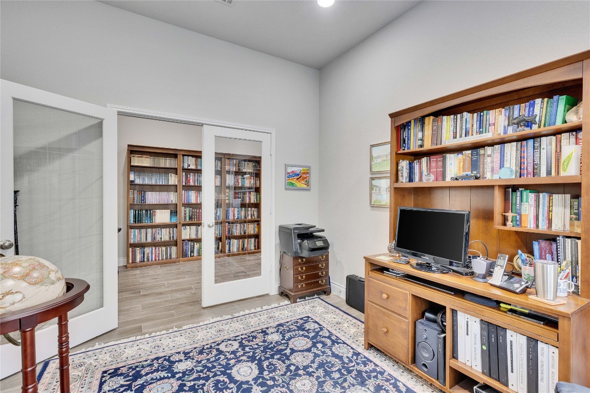 4229 Mercer Road Georgetown, TX 78628 - Photo 24 of 38 Office with baseboards and wood finished floors