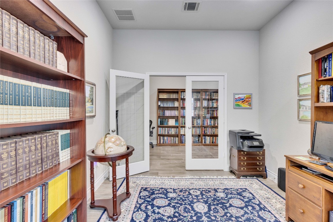 4229 Mercer Road Georgetown, TX 78628 - Photo 25 of 38 Office with baseboards, visible vents, and wood finished floors