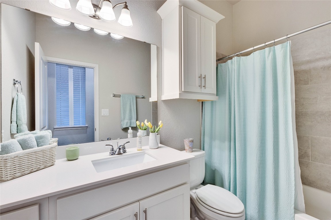 4229 Mercer Road Georgetown, TX 78628 - Photo 27 of 38 Bathroom with vanity, shower / bath combination with curtain, and toilet