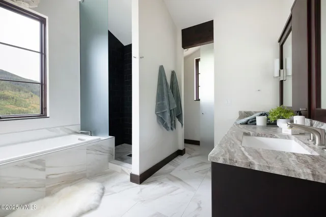 a view of a balcony with chair and wooden floor