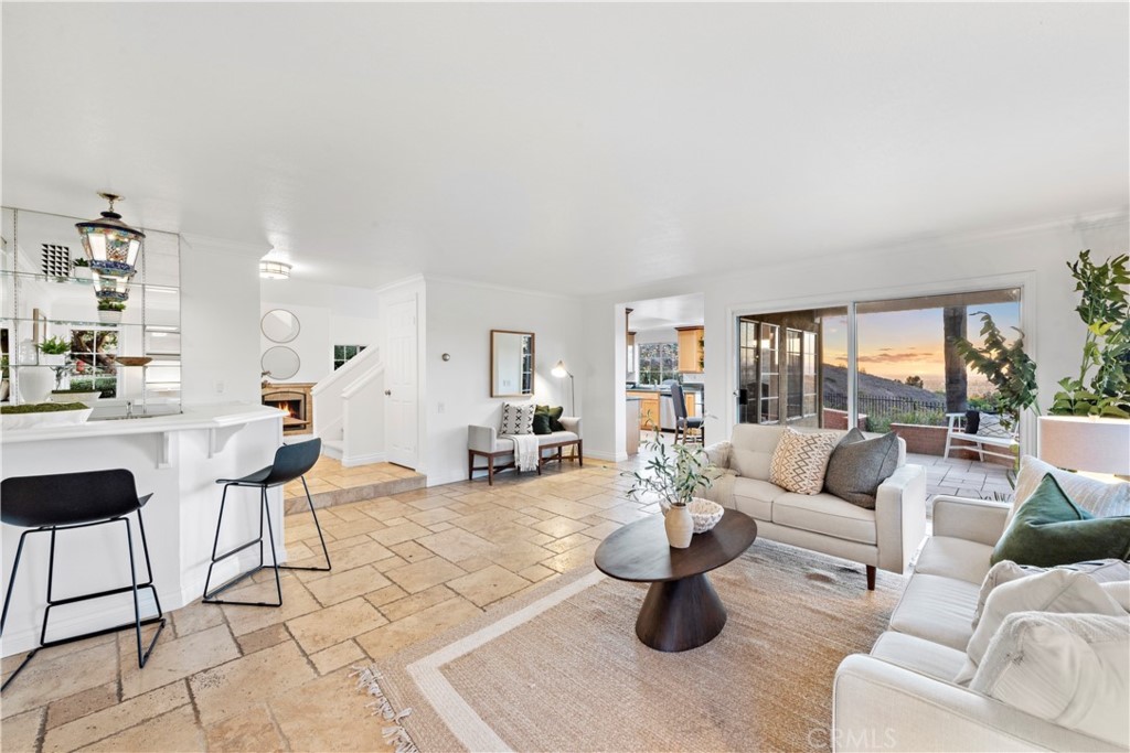 6129 East Joan D Arc Circle Orange, CA 92869 - Photo 12 of 27 a living room with furniture and a large window