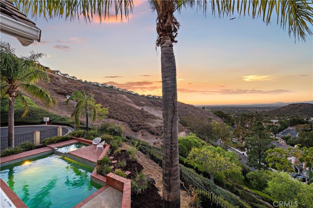 6129 East Joan D Arc Circle Orange, CA 92869 - Photo 16 of 27 a view of a garden with a lake view