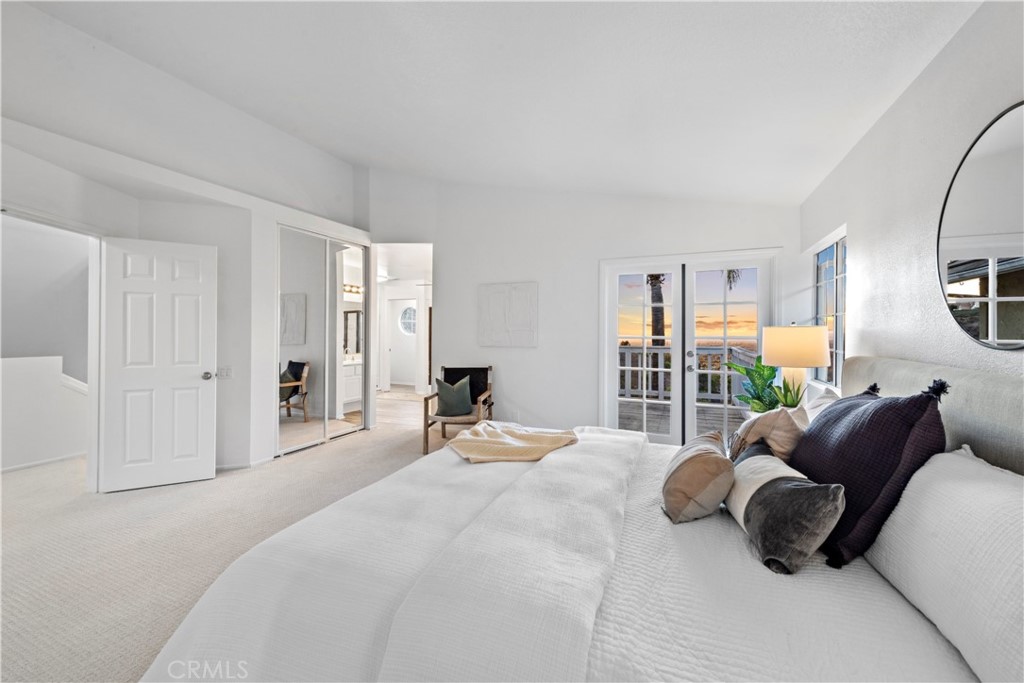 6129 East Joan D Arc Circle Orange, CA 92869 - Photo 18 of 27 a bedroom with a bed couches chair and a large window