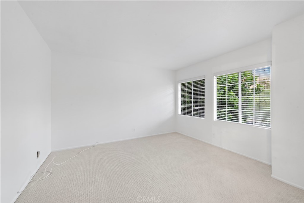 6129 East Joan D Arc Circle Orange, CA 92869 - Photo 23 of 27 an empty room with a window
