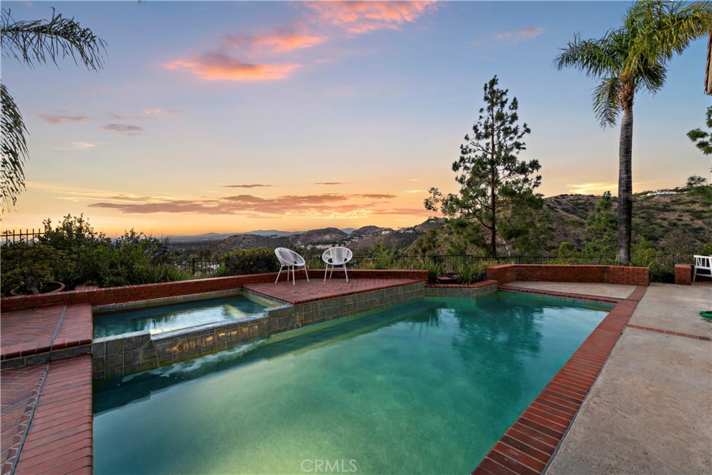 6129 East Joan D Arc Circle Orange, CA 92869 - Photo 27 of 27 a view of swimming pool with lake view