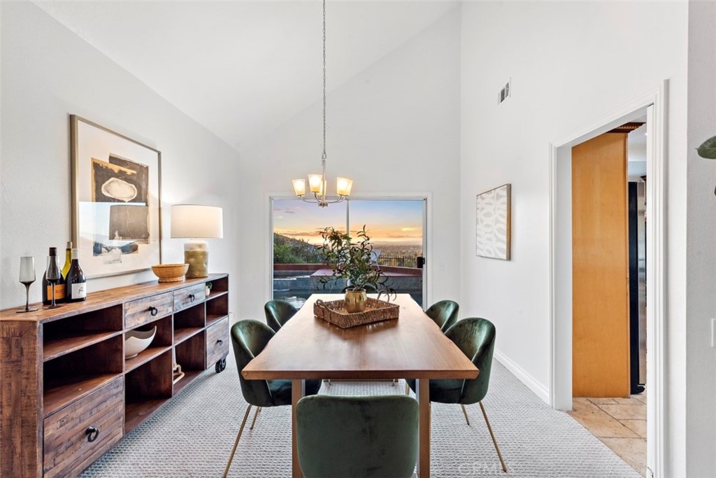 6129 East Joan D Arc Circle Orange, CA 92869 - Photo 7 of 27 a view of a dining room with furniture and window