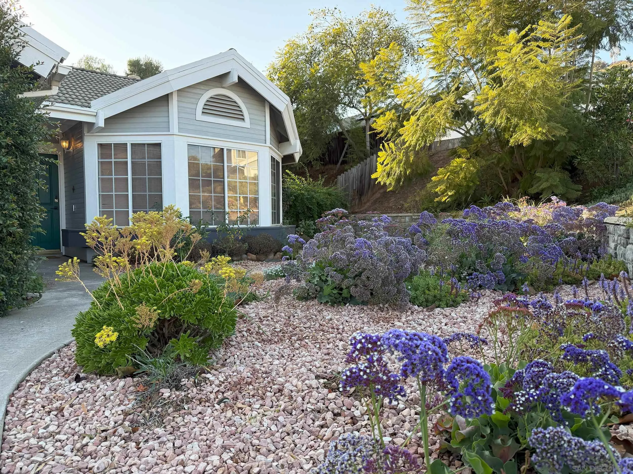 1457 Fallsview Place Escondido, CA 92027 - Photo 2 of 41 a front view of a house with a yard