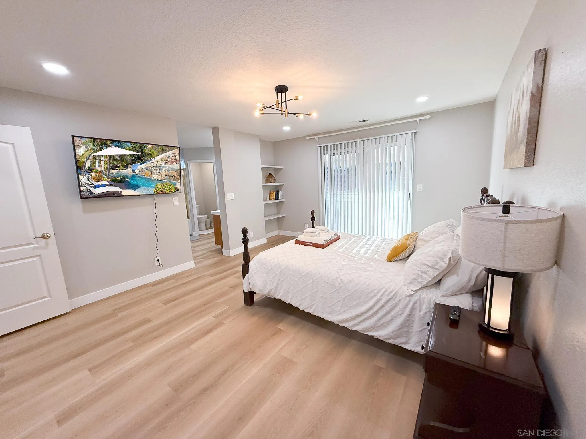 1457 Fallsview Place Escondido, CA 92027 - Photo 21 of 41 a bed room with furniture and a flat screen tv