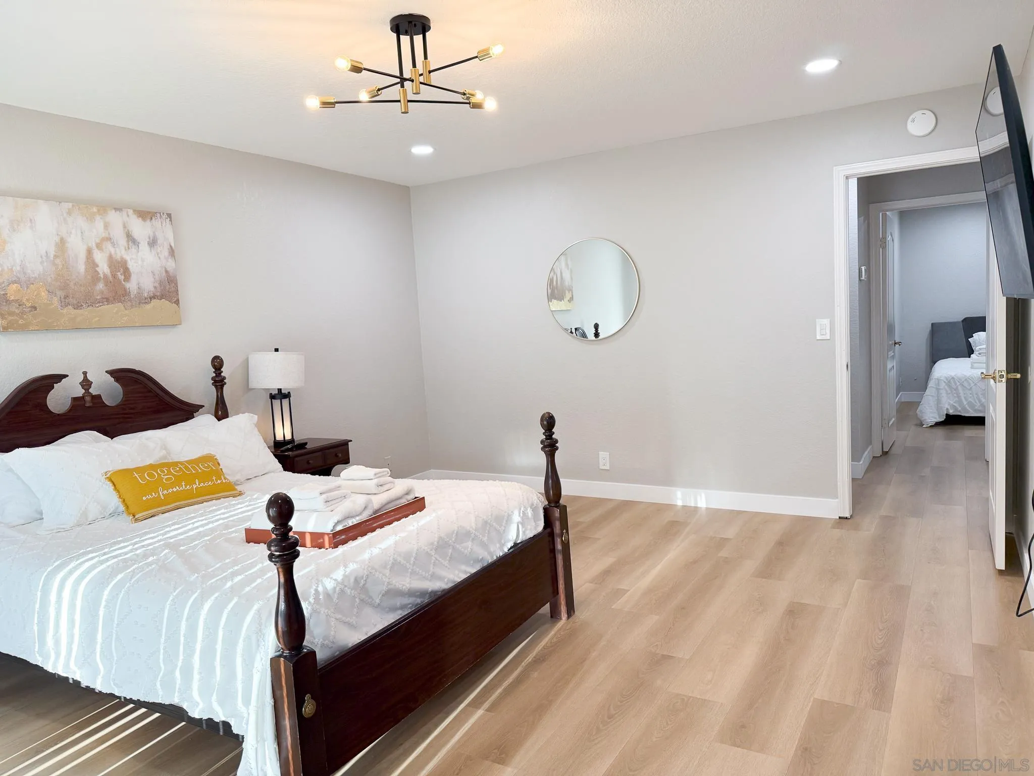 1457 Fallsview Place Escondido, CA 92027 - Photo 22 of 41 a bedroom with bed and a chandelier