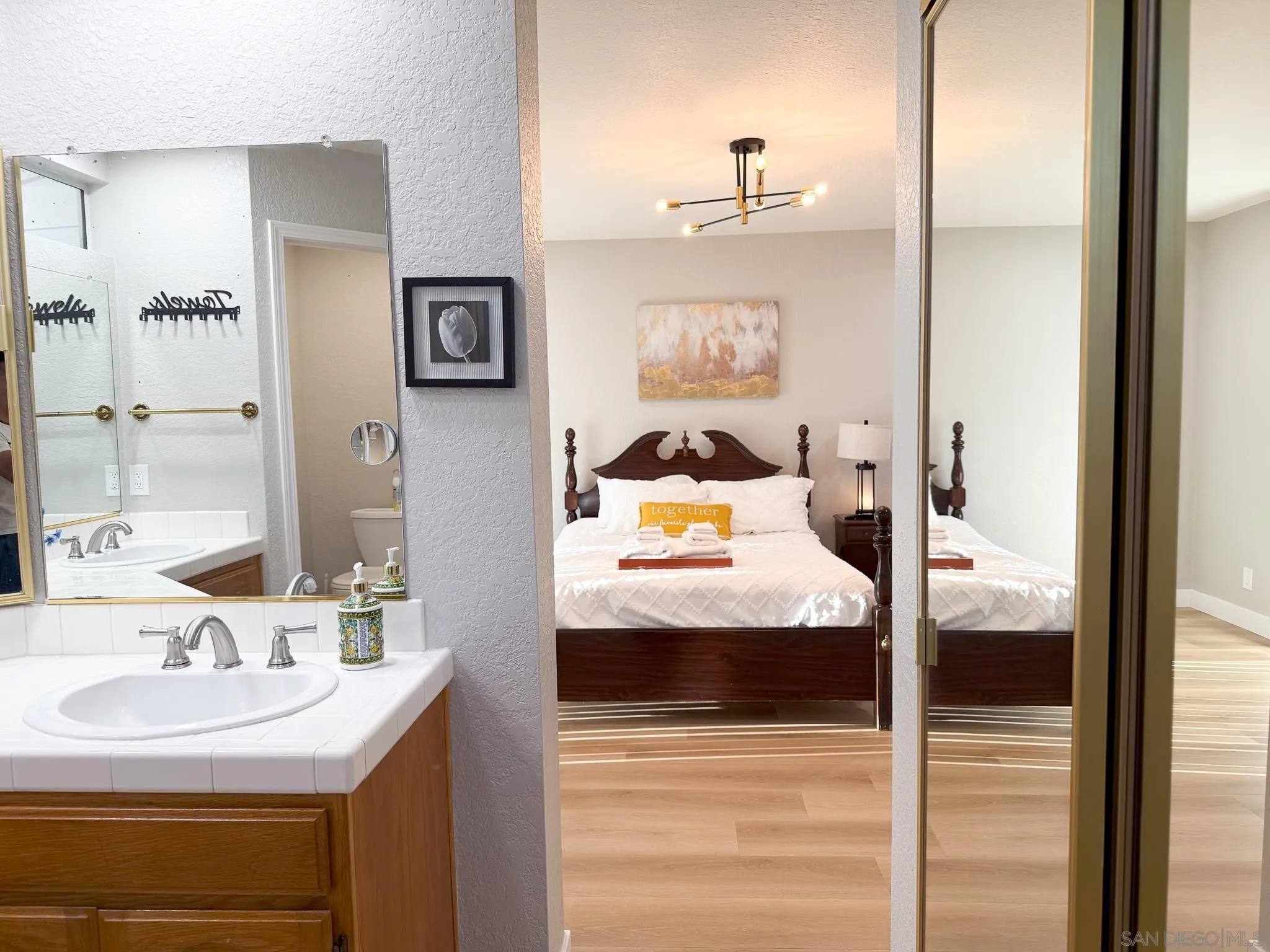 1457 Fallsview Place Escondido, CA 92027 - Photo 25 of 41 a bathroom with a sink and a mirror
