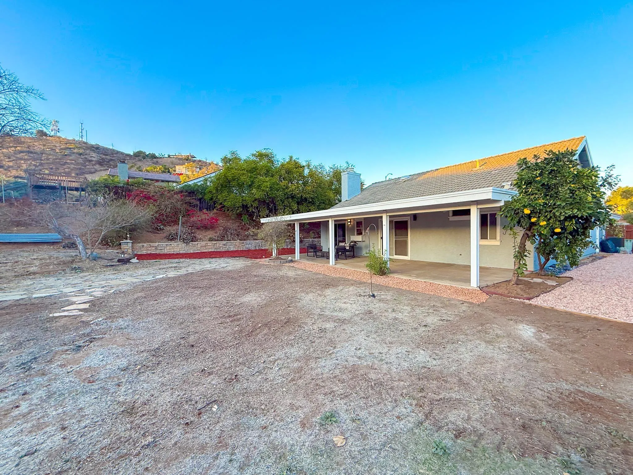 1457 Fallsview Place Escondido, CA 92027 - Photo 35 of 41 a view of a house with a backyard