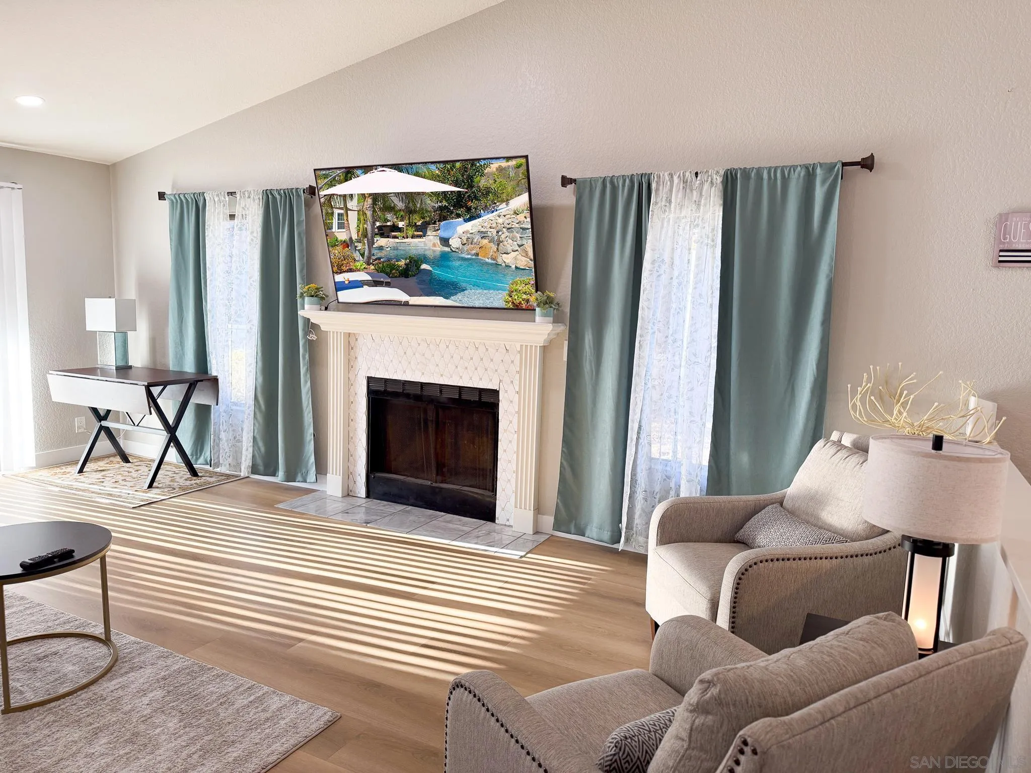 1457 Fallsview Place Escondido, CA 92027 - Photo 8 of 41 a living room with furniture and a fireplace