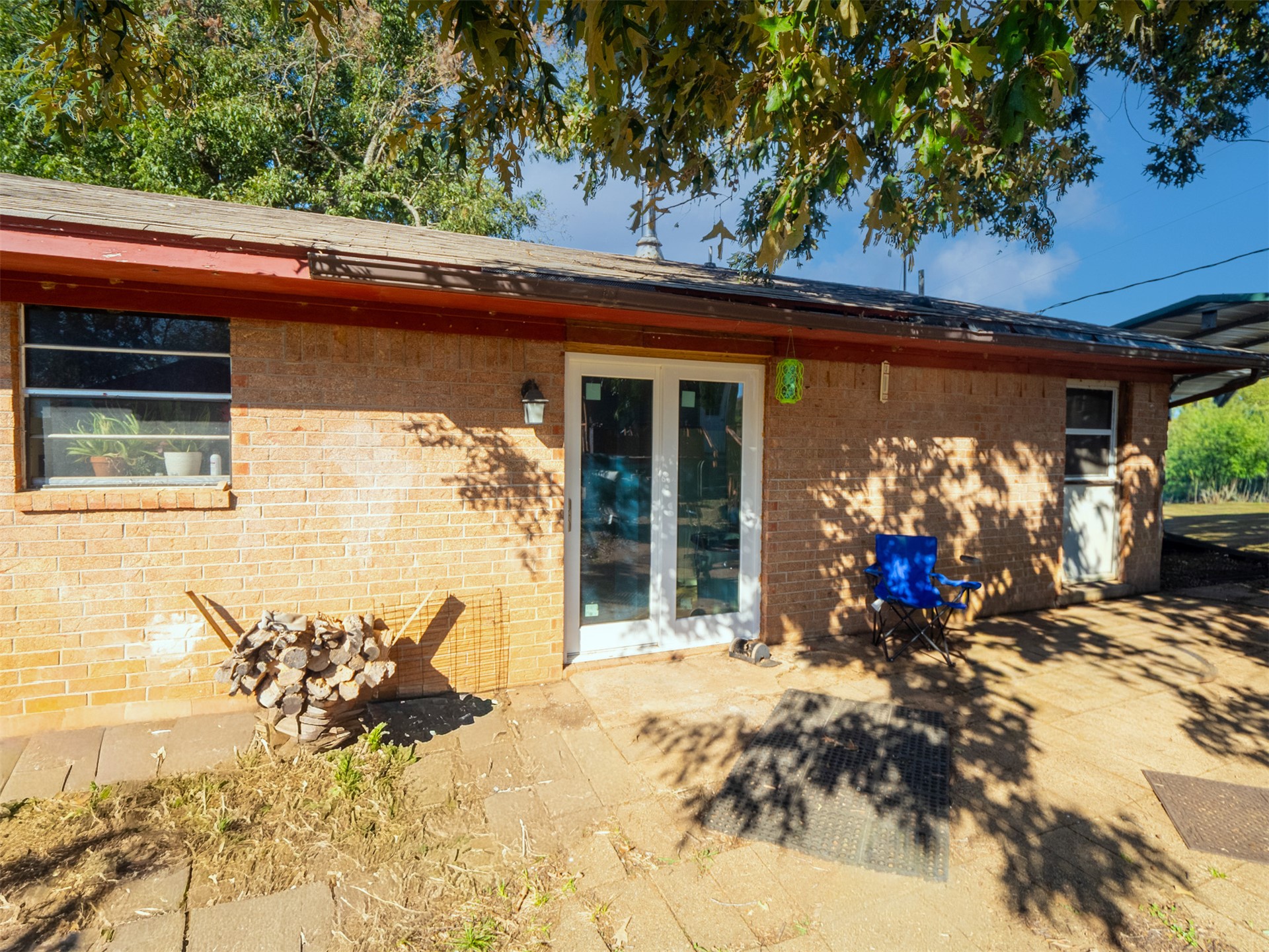 1599 North 4010 Road Boswell, OK 74727 - Photo 39 of 57 Brick exterior with a shingle roof and a covered patio area