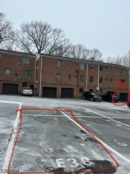 63 Troy Drive, Unit A Springfield, NJ 07081 - Photo 7 of 8 a front view of a building with cars parked