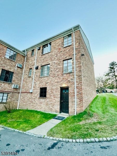 63 Troy Drive, Unit A Springfield, NJ 07081 - Photo 8 of 8 a front view of a house with garden