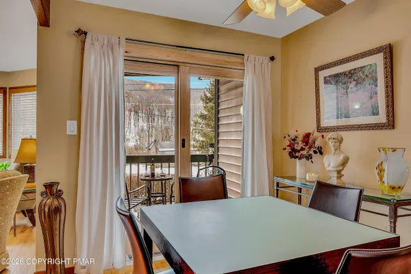 a view of a dining room with furniture window and outside view