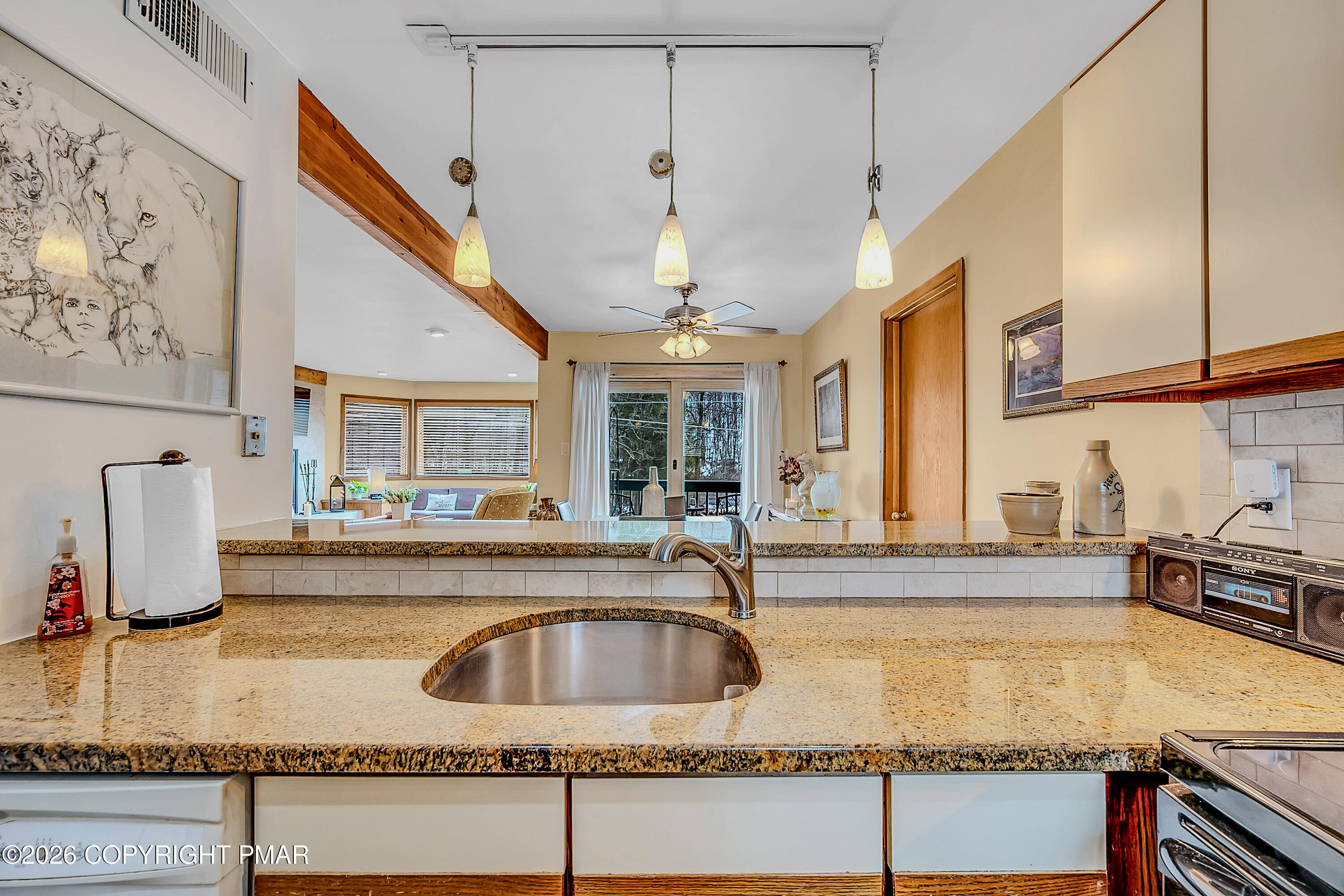 312 Hollow Road, Unit 36 East Stroudsburg, PA 18302 - Photo 15 of 34 a kitchen with a sink a counter and cabinets