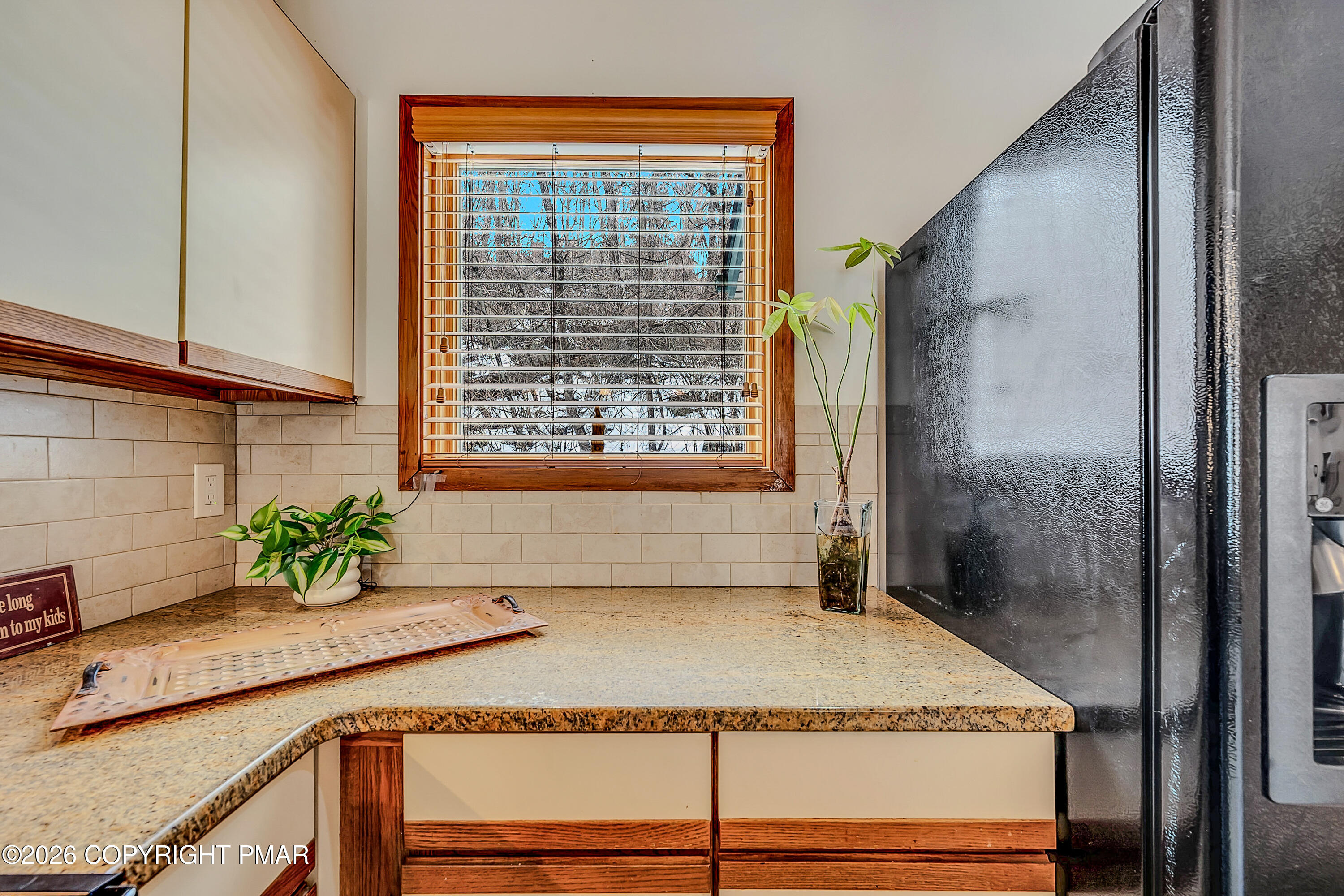 312 Hollow Road, Unit 36 East Stroudsburg, PA 18302 - Photo 16 of 34 a bathroom with a granite countertop sink a mirror and shower