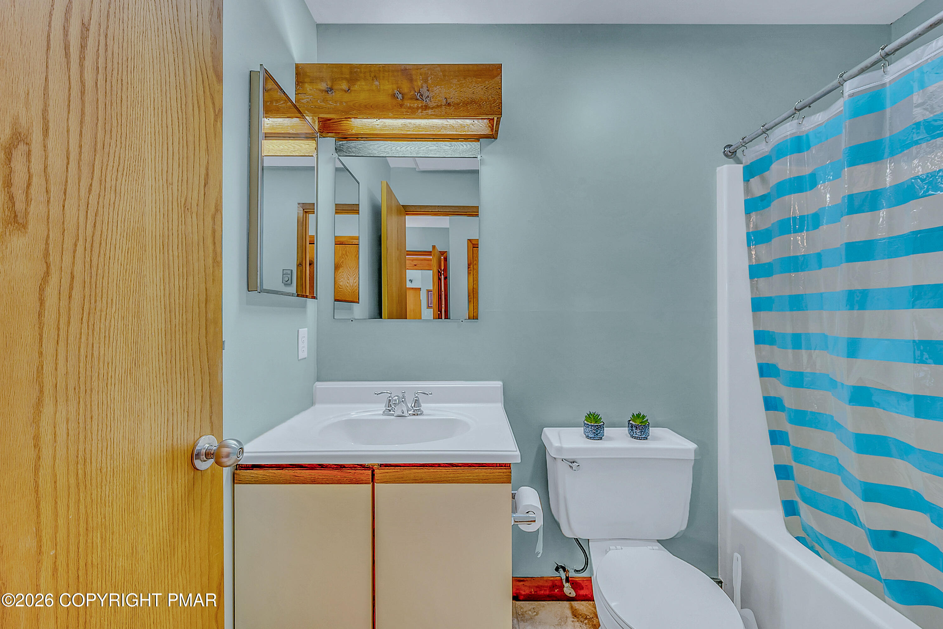 312 Hollow Road, Unit 36 East Stroudsburg, PA 18302 - Photo 20 of 34 a bathroom with a sink and a mirror