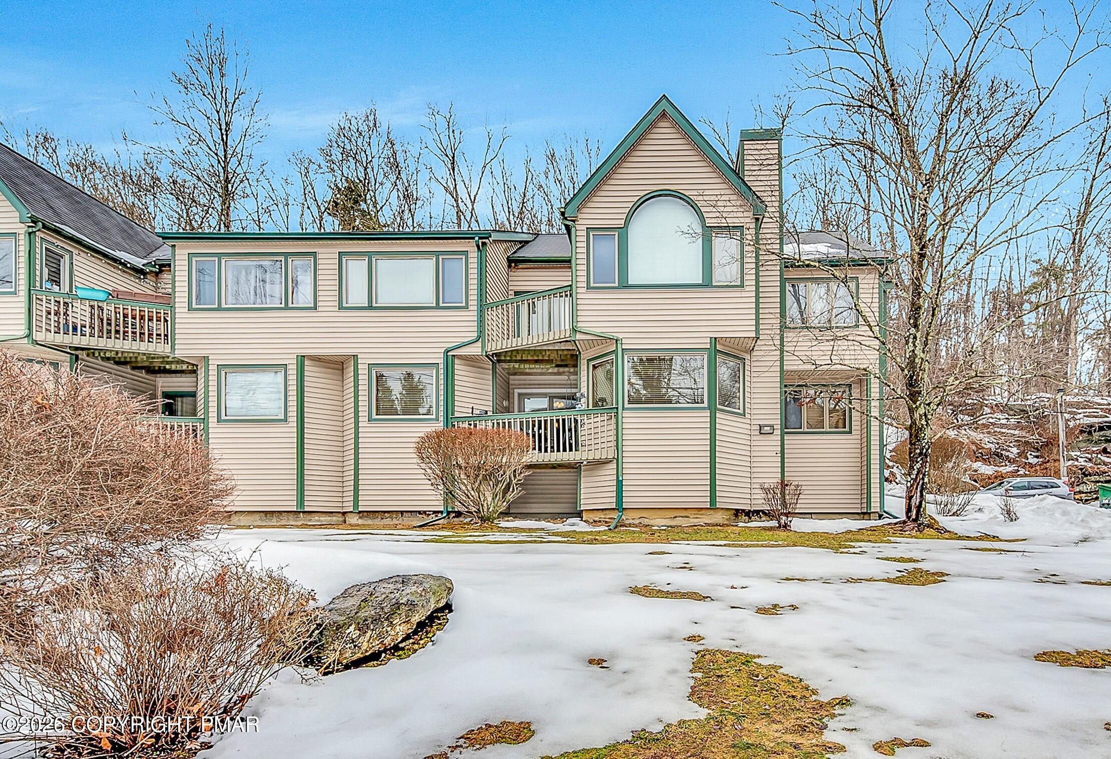 312 Hollow Road, Unit 36 East Stroudsburg, PA 18302 - Photo 2 of 34 a front view of a house with a yard