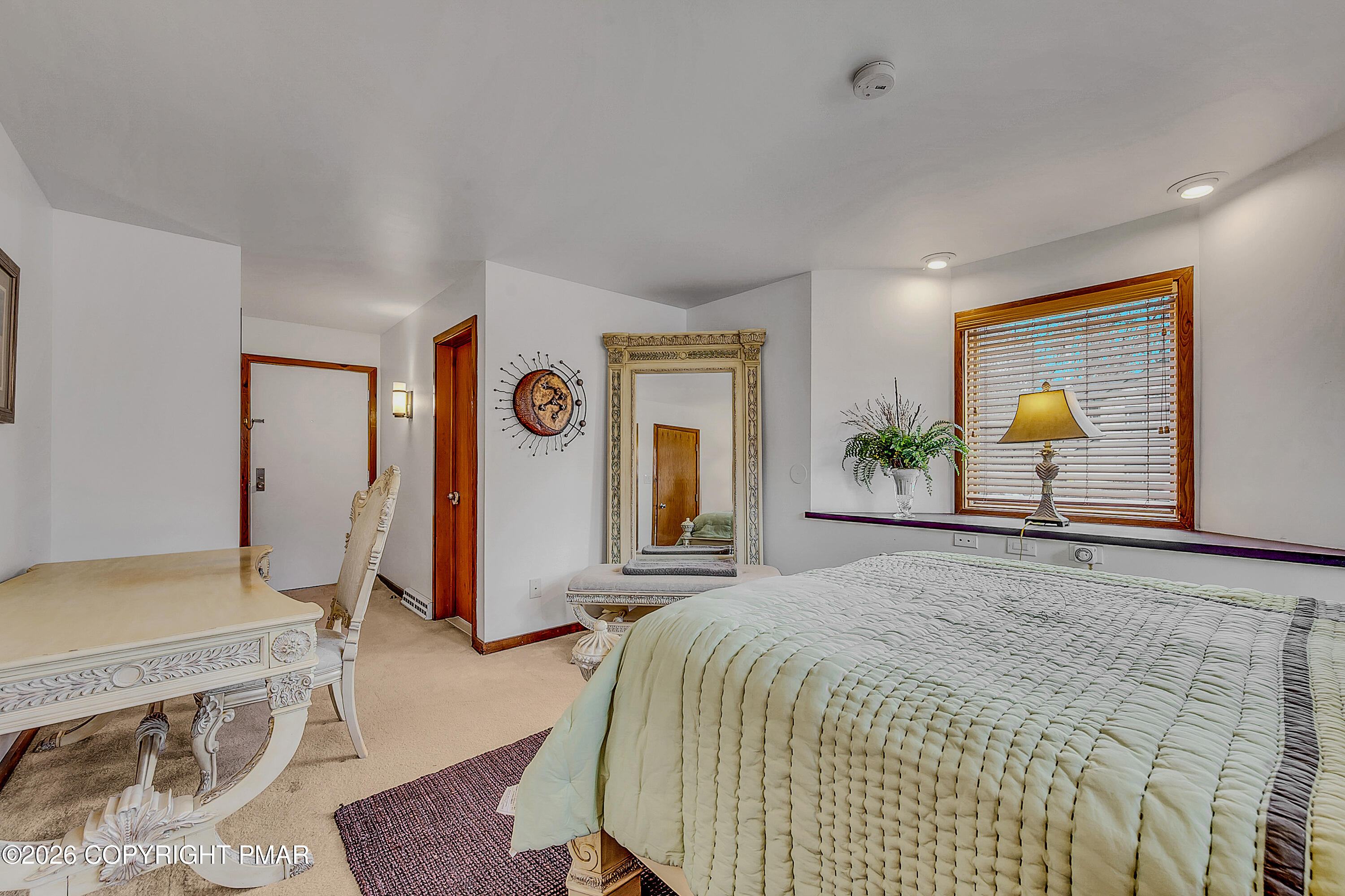 312 Hollow Road, Unit 36 East Stroudsburg, PA 18302 - Photo 22 of 34 a spacious bedroom with a bed and ceiling fan