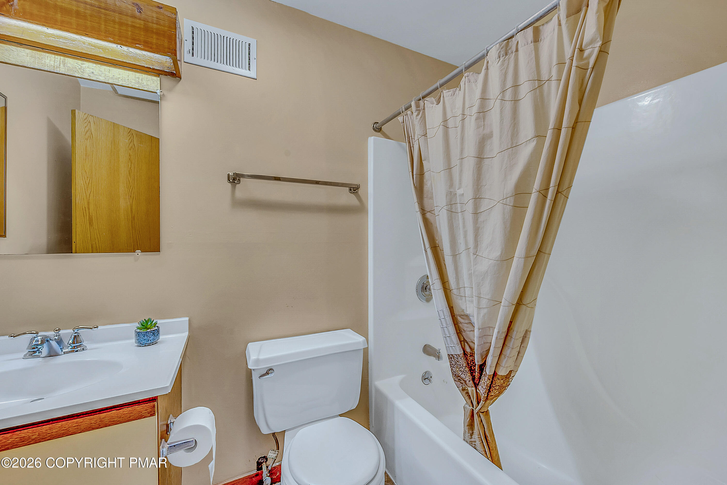 312 Hollow Road, Unit 36 East Stroudsburg, PA 18302 - Photo 29 of 34 a white toilet sitting next to a bathroom sink