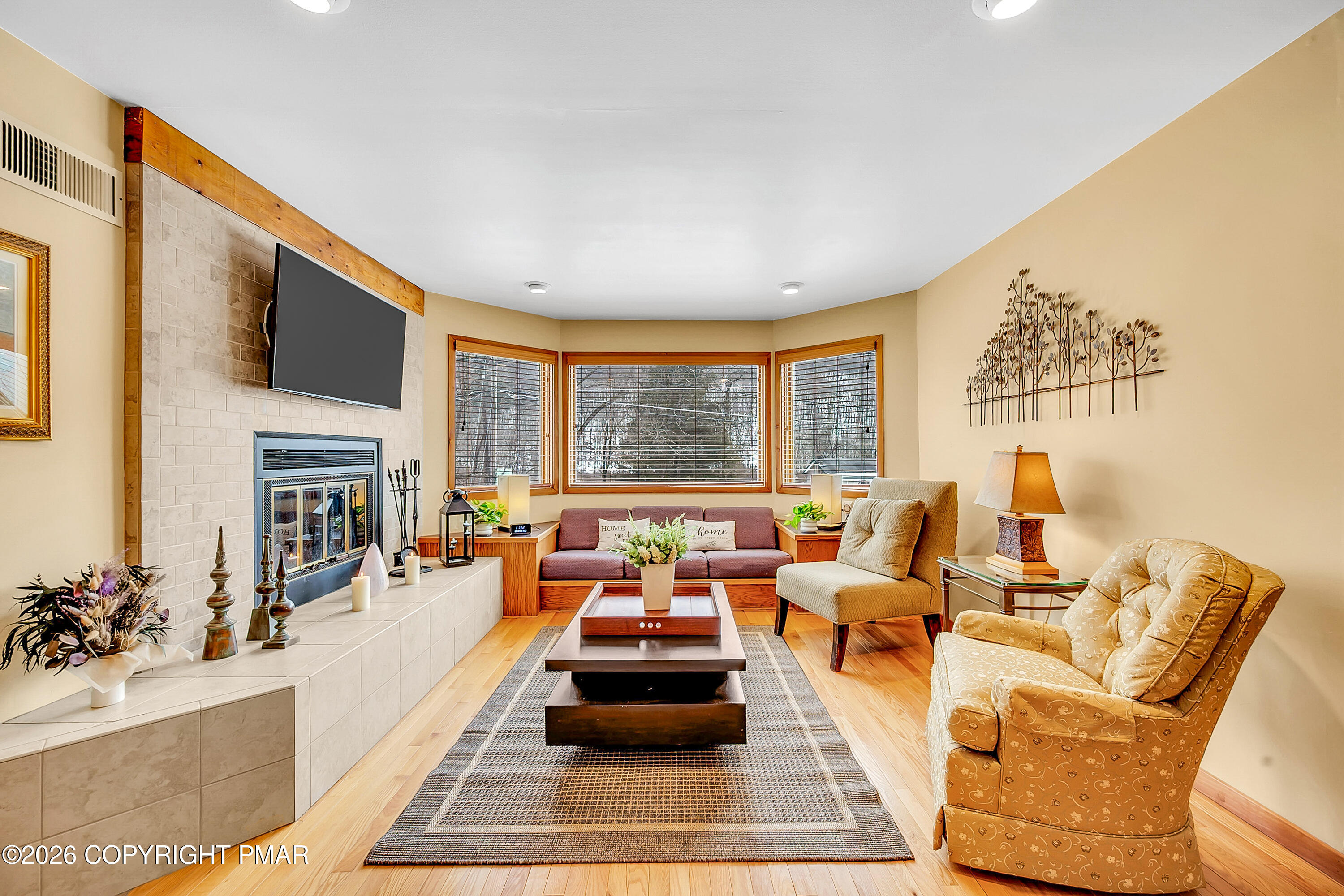 312 Hollow Road, Unit 36 East Stroudsburg, PA 18302 - Photo 3 of 34 a living room with furniture large window and a fireplace