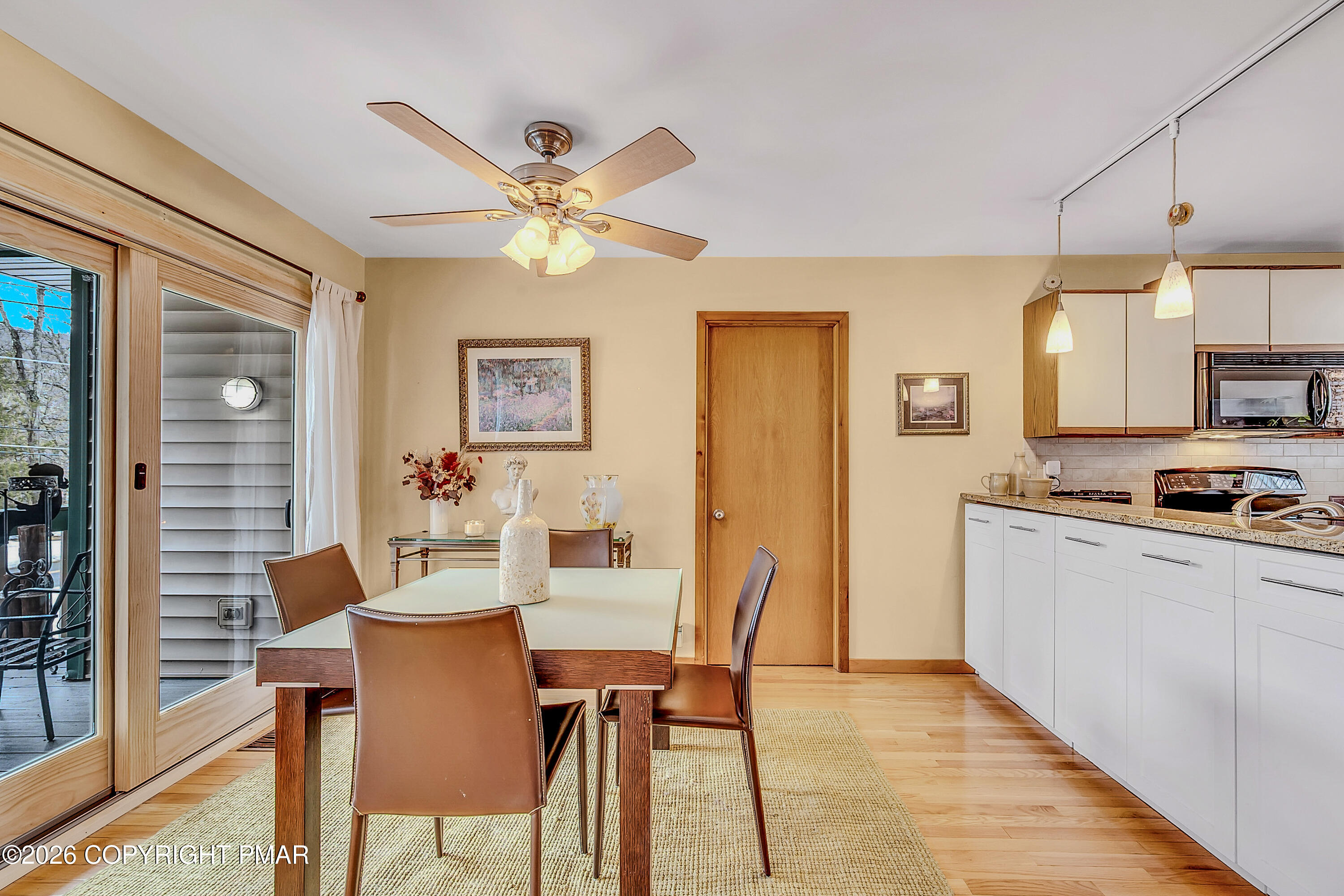 312 Hollow Road, Unit 36 East Stroudsburg, PA 18302 - Photo 7 of 34 a view of a dining room with furniture window and wooden floor