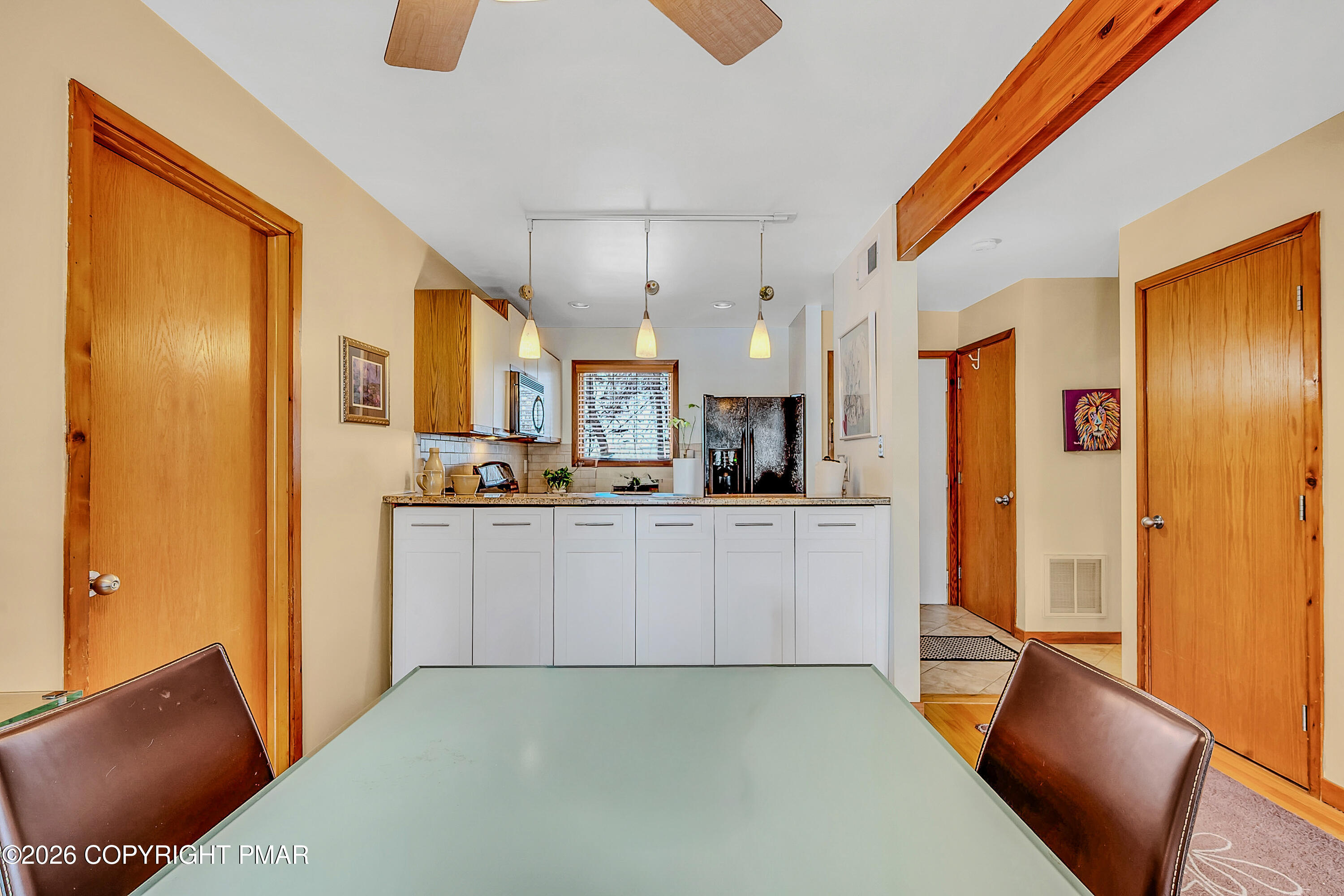 312 Hollow Road, Unit 36 East Stroudsburg, PA 18302 - Photo 9 of 34 a large white kitchen with stainless steel appliances granite countertop a refrigerator and a stove