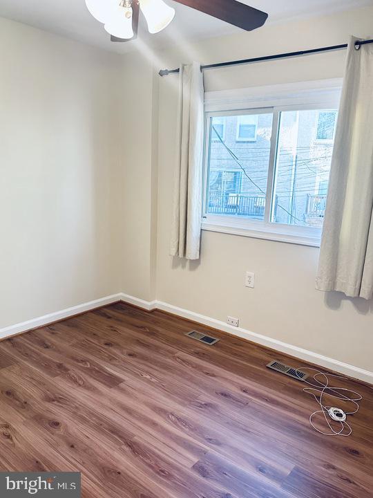 1520 Constitution Avenue Northeast Washington, DC 20002 - Photo 19 of 26 a view of an empty room with wooden floor and a window