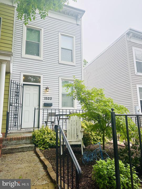 1520 Constitution Avenue Northeast Washington, DC 20002 - Photo 2 of 26 a view of a house with wooden fence