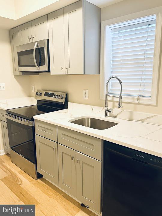 1520 Constitution Avenue Northeast Washington, DC 20002 - Photo 9 of 26 a kitchen with stainless steel appliances granite countertop a sink and a microwave