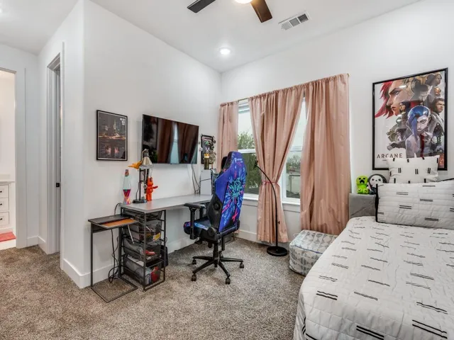 a bedroom with furniture and a bed