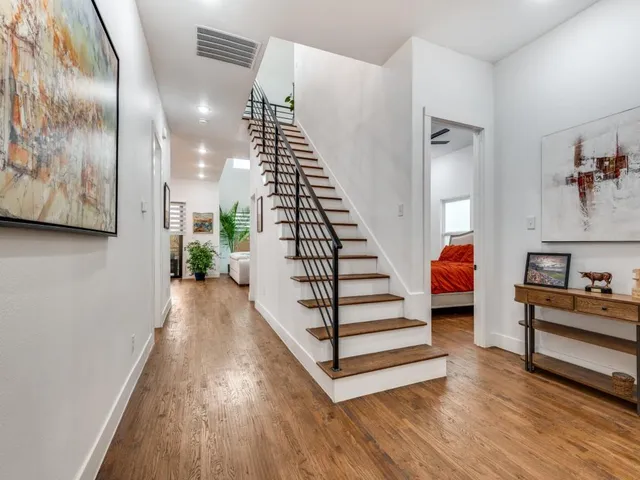a view of entryway and hall with wooden floor