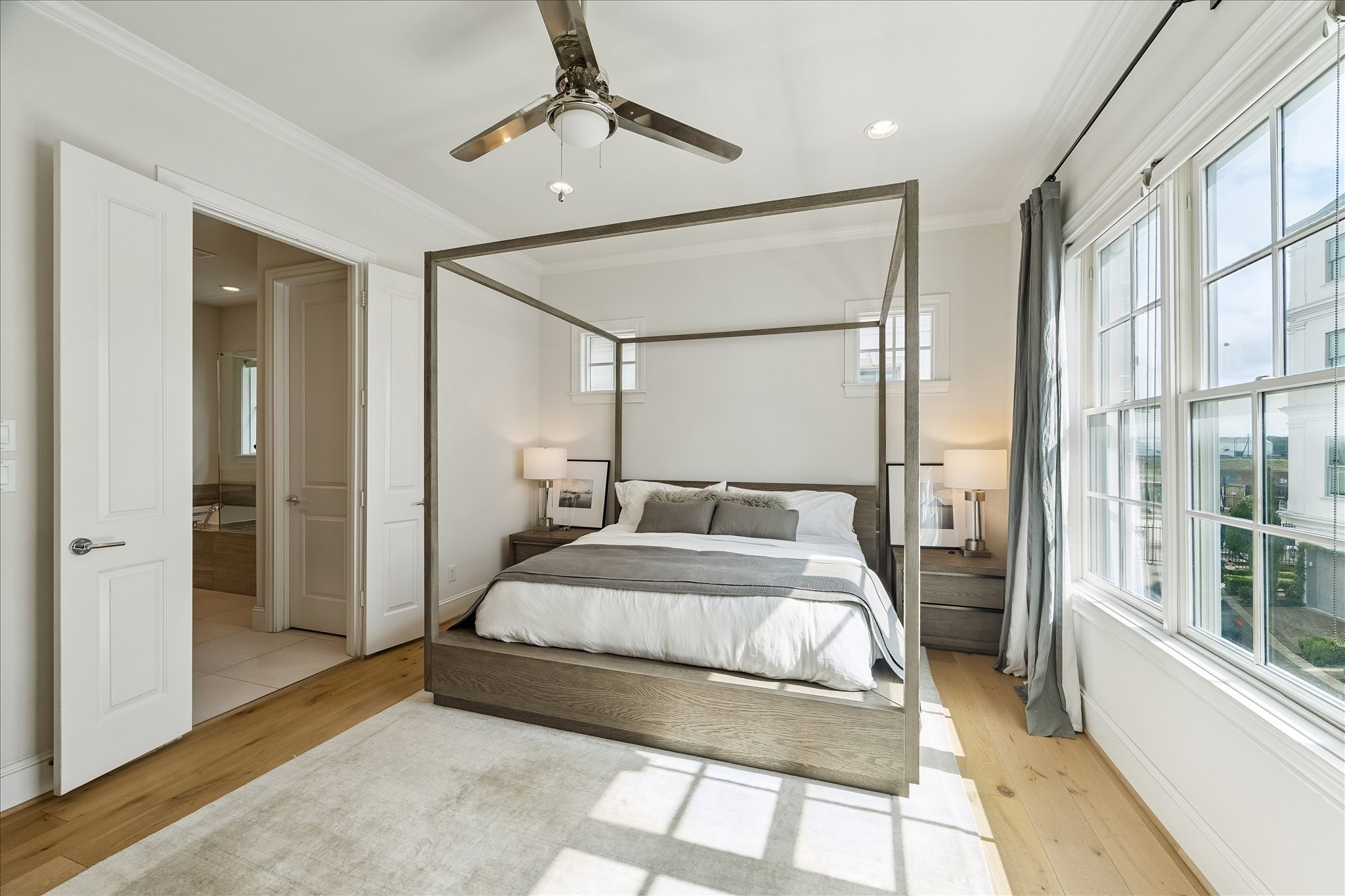 6108 Nicholas Grove Place Houston, TX 77055 - Photo 11 of 29 The double-door entry opens to the elegant primary bath, thoughtfully designed with luxury, comfort, and functionality in mind.