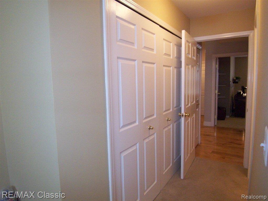 577 Snowfall Court, Unit 48 Howell, MI 48843 - Photo 10 of 24 Mstr Clos Hall.JPG