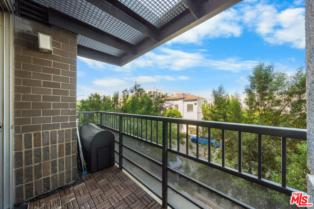 629 Traction Avenue, Unit 233 Los Angeles, CA 90013 - Photo 11 of 41 a view of a balcony with wooden floor