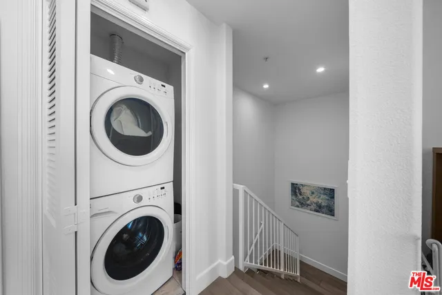 a view of a hallway with washer and dryer