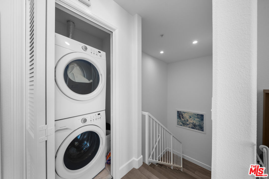 629 Traction Avenue, Unit 233 Los Angeles, CA 90013 - Photo 16 of 41 a view of a hallway with washer and dryer