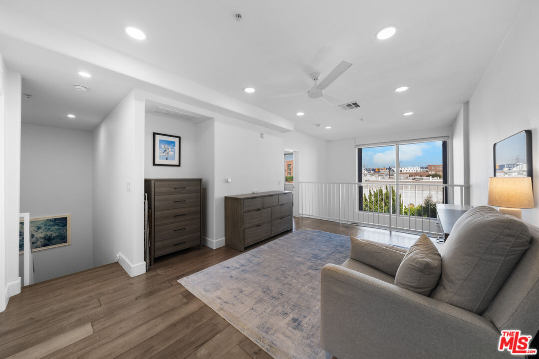 629 Traction Avenue, Unit 233 Los Angeles, CA 90013 - Photo 19 of 41 a living room with furniture and a wooden floor