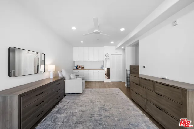 a large bathroom with a large tub and sink