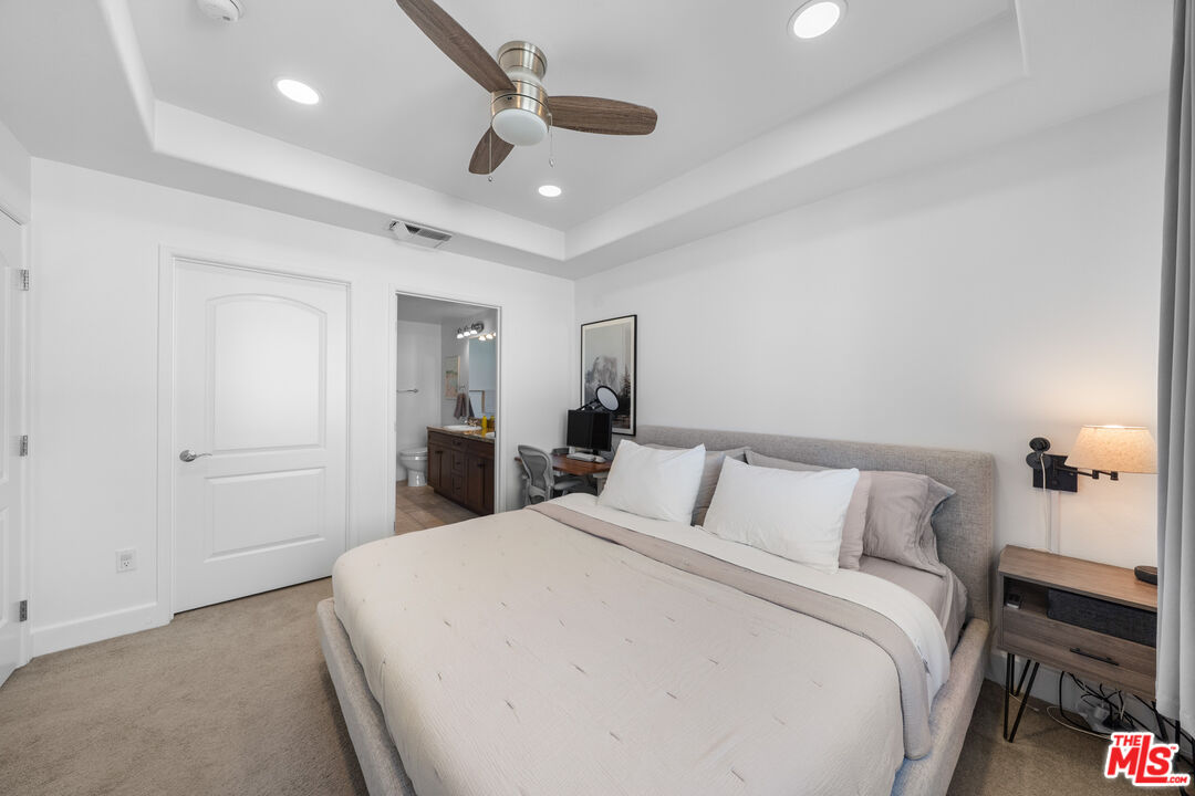 629 Traction Avenue, Unit 233 Los Angeles, CA 90013 - Photo 22 of 41 a bedroom with a large bed and a chandelier