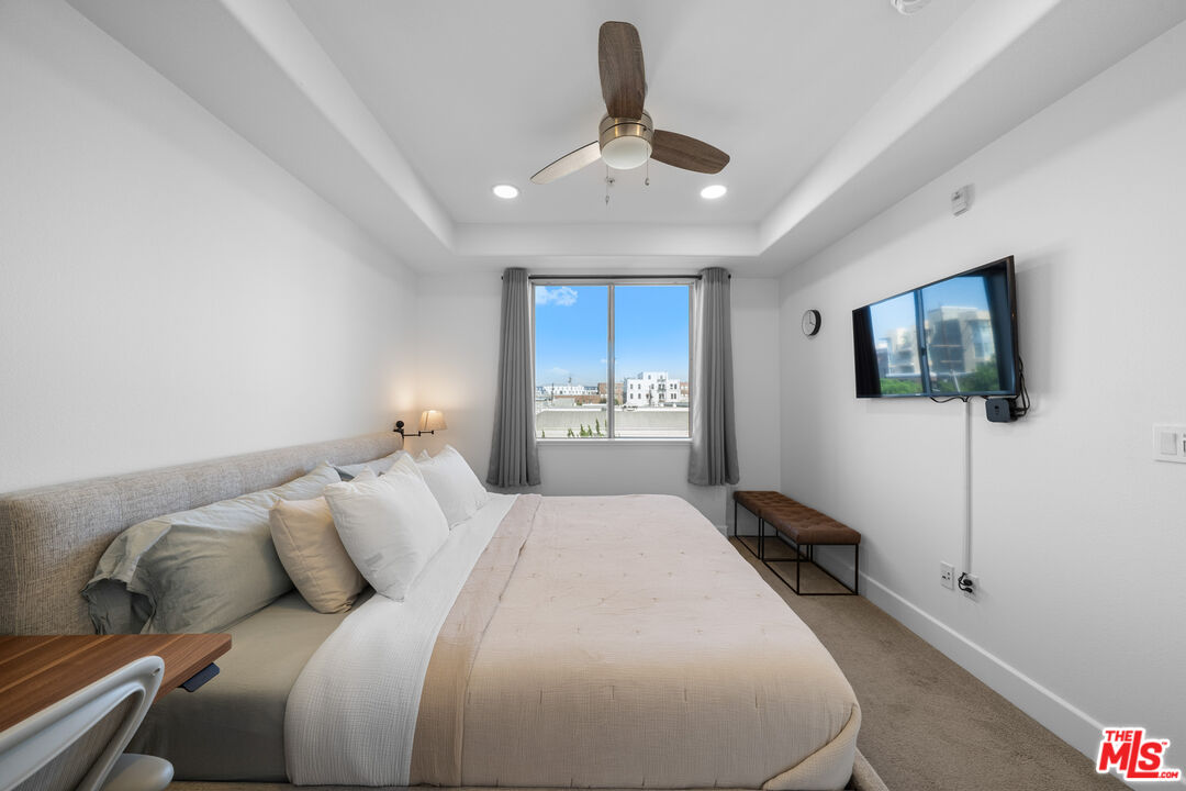 629 Traction Avenue, Unit 233 Los Angeles, CA 90013 - Photo 23 of 41 a bedroom with a large bed and a window