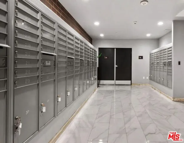 a view of a swimming pool and lounge chairs